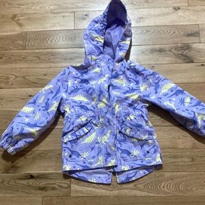 Ripzone light purple with purple and yellow dinosaurs on it rain jacket